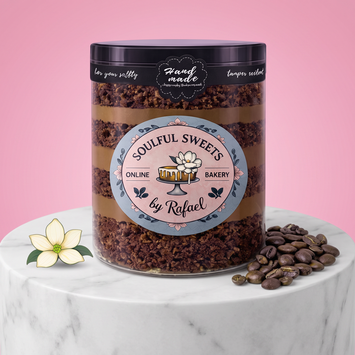 Soulful Sweets by Rafael chocolate espresso cake layered in a clear plastic jar on a marble pedestal with coffee beans